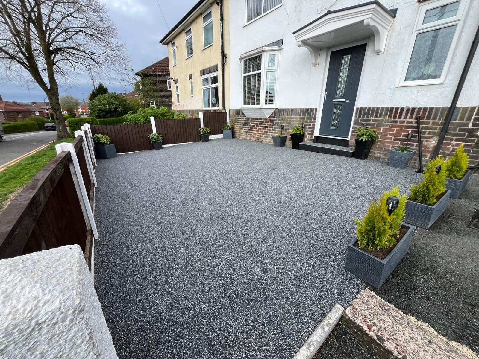 Resin bound driveway in dark speckled aggregate at a semi detached house