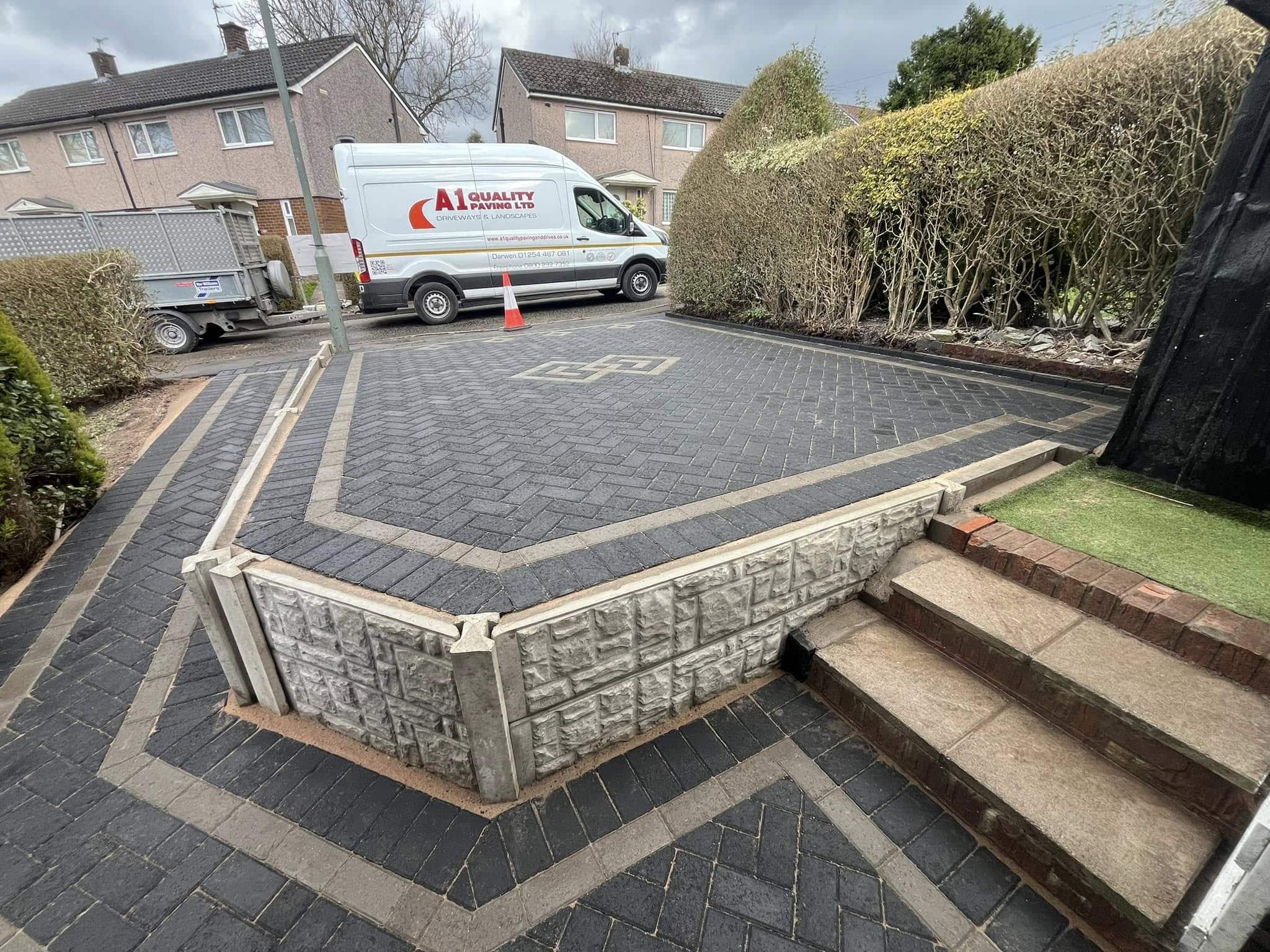 A1 Quality Paving van on a completed charcoal block paved driveway with new walling and steps