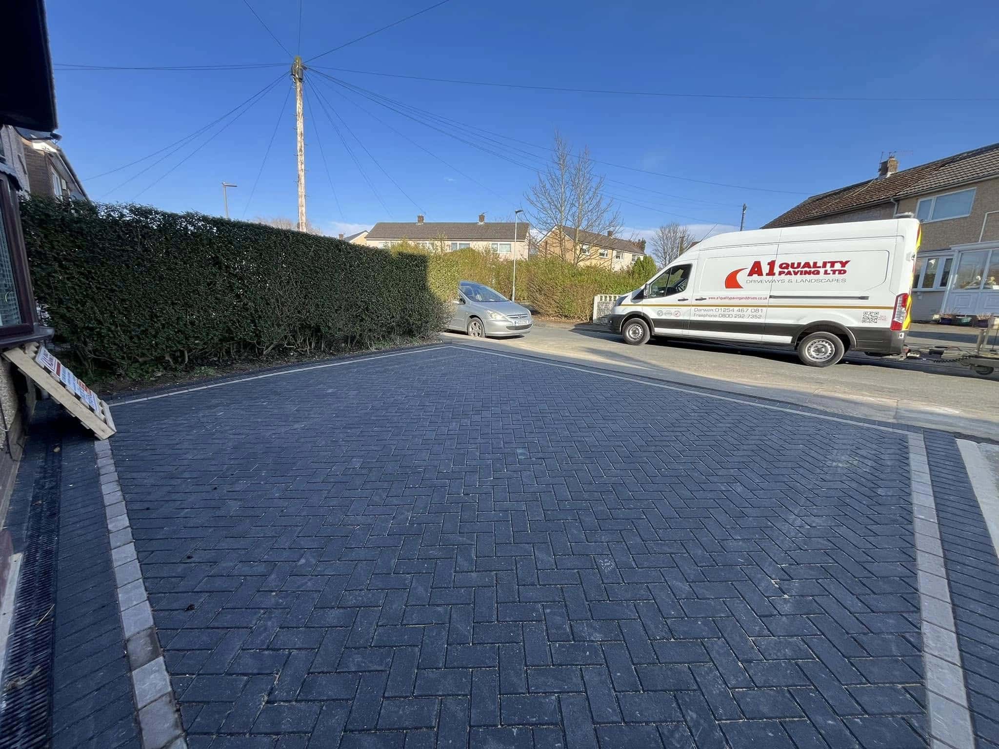 Charcoal block paved driveway in Darwen with the A1 Quality Paving van parked alongside